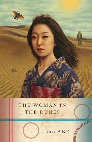 Book cover for 'The Woman in the Dunes' by Kobo Abe, featuring a woman in a kimono against a desert landscape with a distant figure and a beetle.